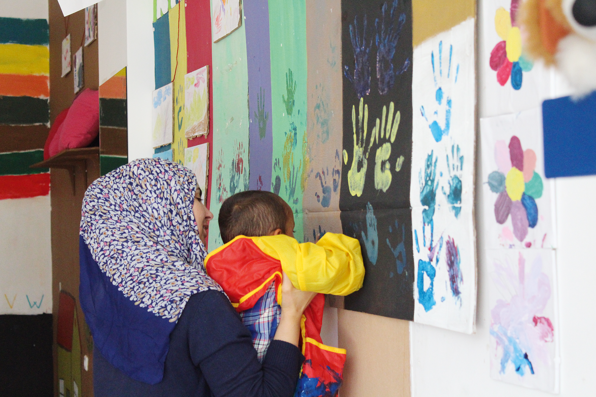 Children can leave their own imprint in Refugee Trauma Initiative's Baytna spaces